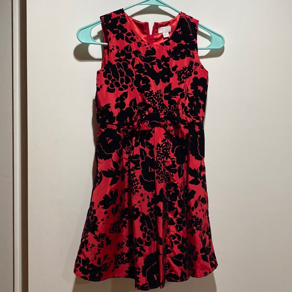 Red dress with black flowers and bow